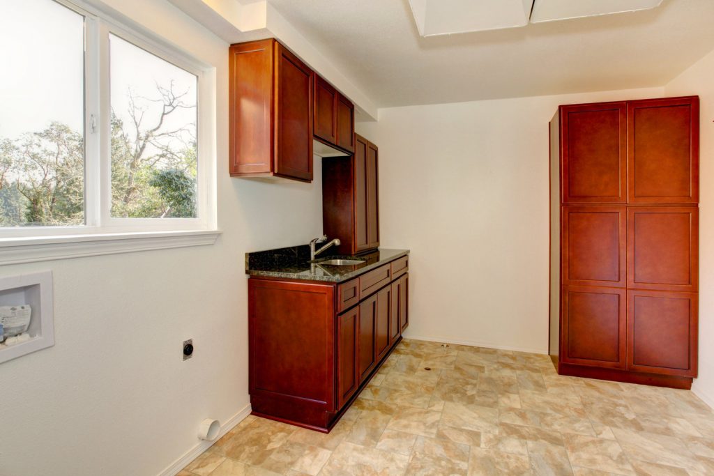 empty room with wooden cabinets