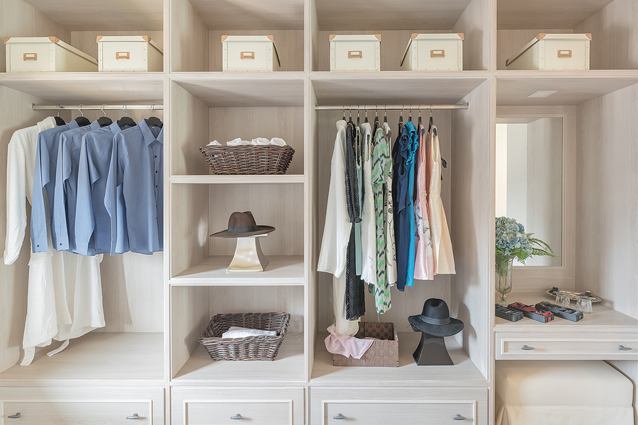 walk in white cabinet with clothes